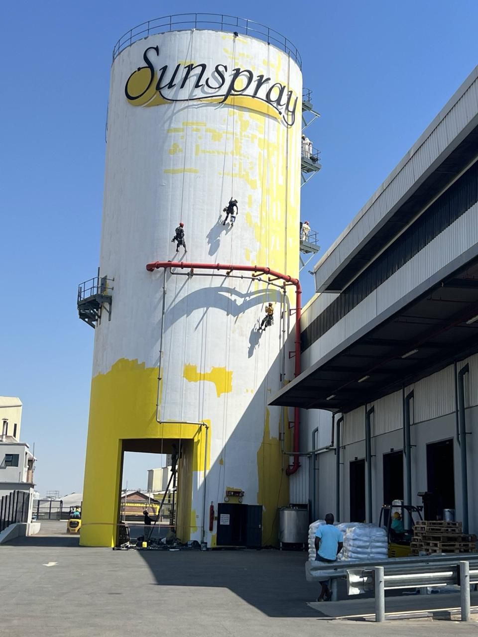 Rope access industrial silo painting Sandton Johannesburg in progress abseiling