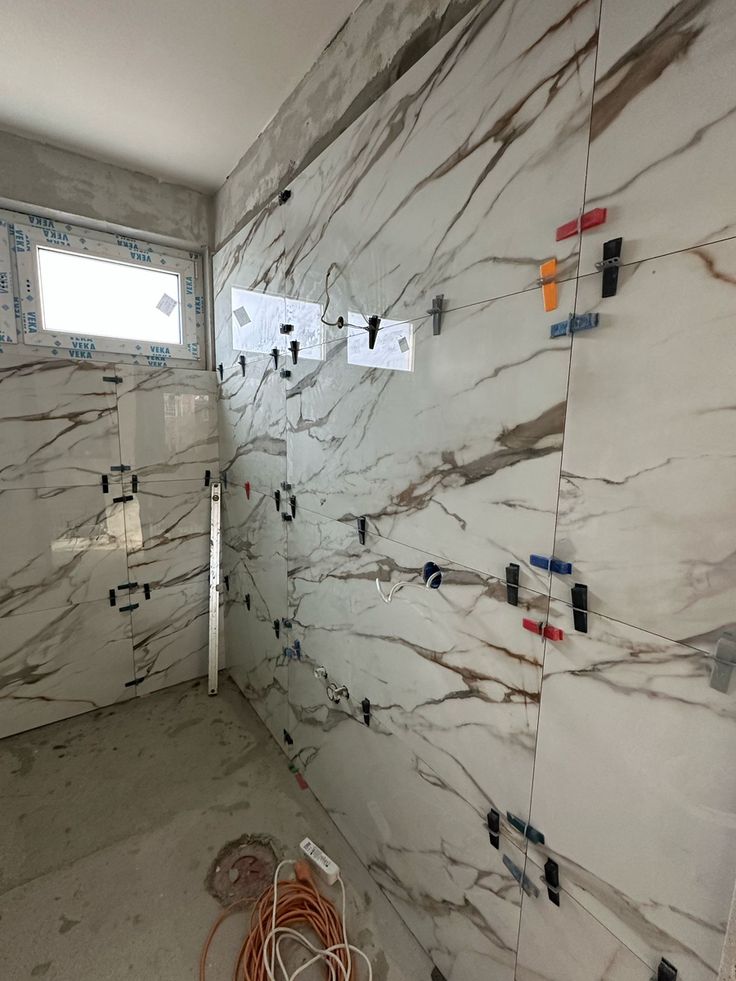 Wall tiling marble effect Plumstead Scotch Score Holdings